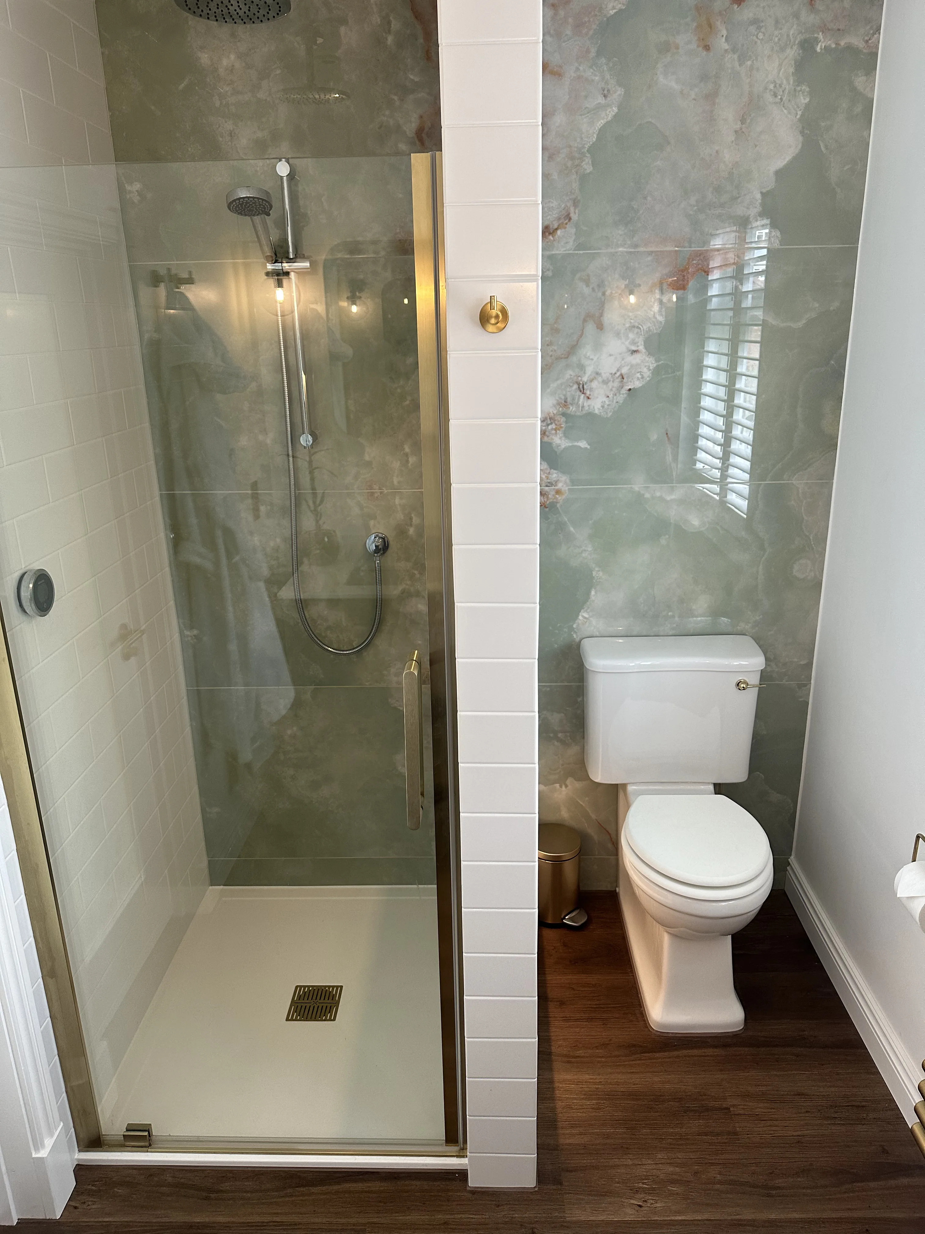Tiled bathroom with new suite installed